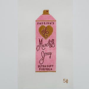 May include: A pink spray bottle design with the text "Sabrina's Marchild Spray" and a gold heart. The words "Ultra Soft Formula" are below the spray bottle. The number "54¢" is in the bottom right corner.