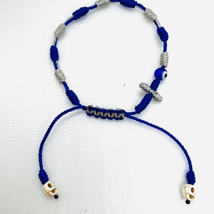 Pulsera de hilo nudos denario crucifico y del mal ojo