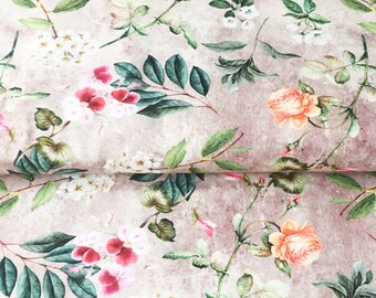 May include: A beige fabric with a floral print featuring pink, white, and orange flowers. The flowers are surrounded by green leaves and the background has a subtle distressed look.