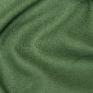 May include: Close-up of a soft, green fabric with a textured surface. The fabric is folded and draped, creating a smooth, flowing look.