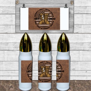 May include: Three white bullet-shaped water bottles with gold tops. Each bottle has a brown leather-like label with the text "HEROES DON'T WEAR CAPES THEY WEAR DOG TAGS & COMBAT BOOTS" and an image of combat boots and the American flag.