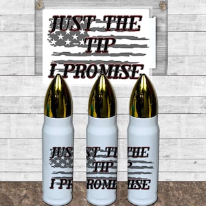 May include: Three white bullet-shaped tumblers with gold tops. Each tumbler features a gray and white American flag design with the text "Just the Tip I Promise" in red and black.