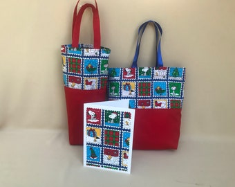 May include: A set of Christmas-themed fabric items featuring Snoopy. Includes a tall red tote bag with red handles, a larger tote bag with blue handles, and a greeting card. The fabric has a repeating pattern of Snoopy in Christmas scenes.