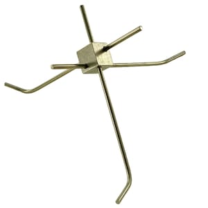 May include: A brass-colored metal object with a central cube and six radiating rods. The rods are straight or curved, creating a star-like or abstract design. The object is set against a white background.