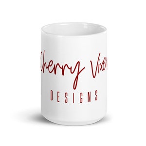 May include: White ceramic mug with the text "Cherry Vixen Designs" in red cursive lettering.
