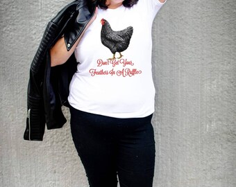 May include: White t-shirt with a black and white chicken illustration and the text "Don't Get Your Feathers In A Ruffle".