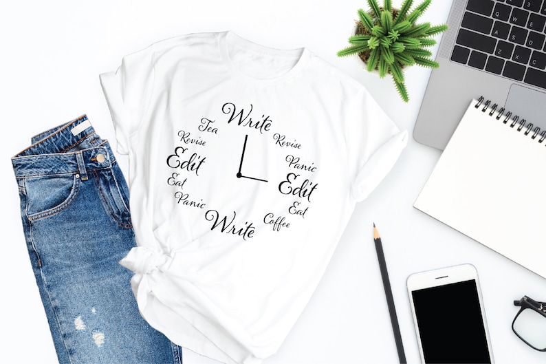 May include: White t-shirt with a clock design featuring the words "Write", "Revise", "Edit", "Panic", "Eat", "Tea", and "Coffee".