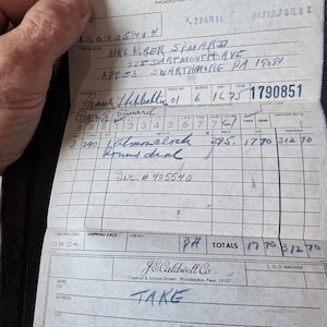 May include: A vintage J.E. Caldwell Co. customer copy receipt, dated June 16, 1975, with handwritten details. The receipt includes the customer's name, address, and a list of purchased items, including an "almozalock". The total amount is $312.70.