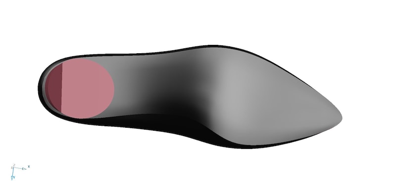May include: A black leather shoe sole with a pink insole.
