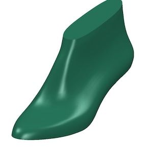 May include: A solid teal-colored shoe last, a form used in shoemaking. The form is smooth and curved, with a pointed toe and a heel. The shoe last is designed to shape the shoe during construction. The background is white.