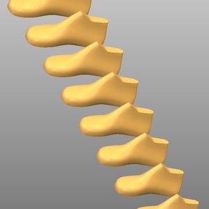 May include: A set of eight wooden shoe forms in various sizes, stacked in a descending order, with a light brown color.