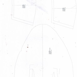 May include: A white paper pattern for a garment with the text "1-6-cool  KOBYETTA  COOPER  N.43.X.2  8.1.18  P.72/26"