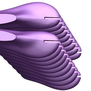 May include: A stack of ten purple shoe lasts, a tool used in shoemaking to create the shape of a shoe.