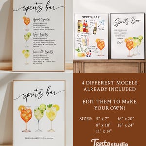 May include: Four framed prints with "Spritz Bar" text and cocktail recipes. One print lists Aperol, Hugo, and Limoncello Spritz recipes. Other prints show cocktail illustrations and instructions. The bottom right print has the text "4 DIFFERENT MODELS ALREADY INCLUDED".