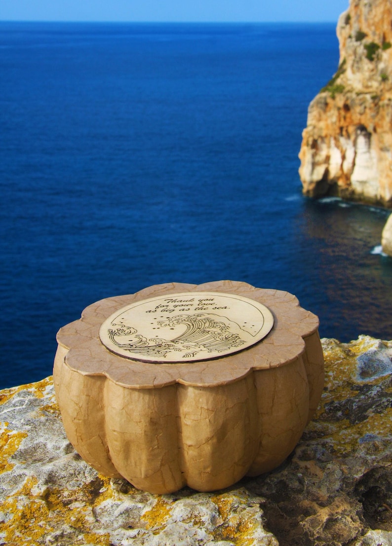 BLUE SOUL biodegradable memorial urn handmade from paper mache, with a round wooden lid and natural handcrafted texture
