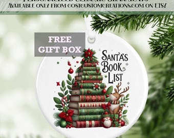 May include: A white ceramic Christmas ornament with a festive design. The ornament features a stack of books shaped like a Christmas tree, with the text "Santa's Book List". A reindeer and gifts are also depicted. The text "Personalized Ceramic Ornaments" is at the top.