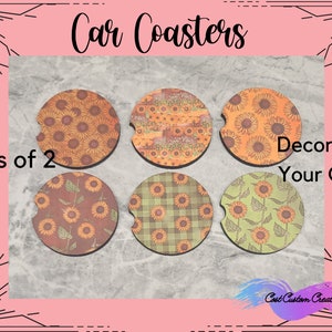 May include: Set of six car coasters with various sunflower and plaid designs. The coasters are made of cork and have a round shape. The text "Sets of 2" and "Decorate Your Car" is visible in the image.