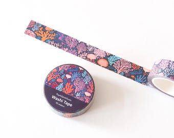 May include: A roll of washi tape with a coral reef design. The tape is 10 meters long and is packaged in a clear plastic container with a black label that says "Washi Tape".