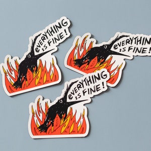 May include: Three black bird stickers with the text "Everything is fine!" on a white background. The birds are depicted in a cartoon style with their beaks open and their eyes wide. The birds are surrounded by flames.