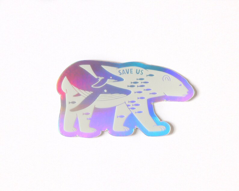 May include: A holographic sticker featuring a polar bear with a whale and fish swimming around it. The sticker says "Save Us" on the bear's back.