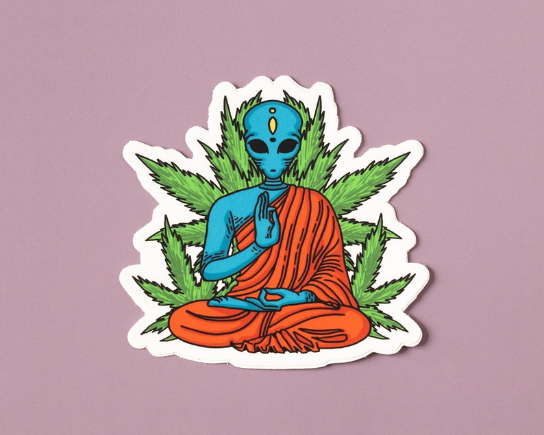 May include: A blue alien meditating in a red robe, surrounded by green marijuana leaves. The alien has a third eye and is in a lotus position.