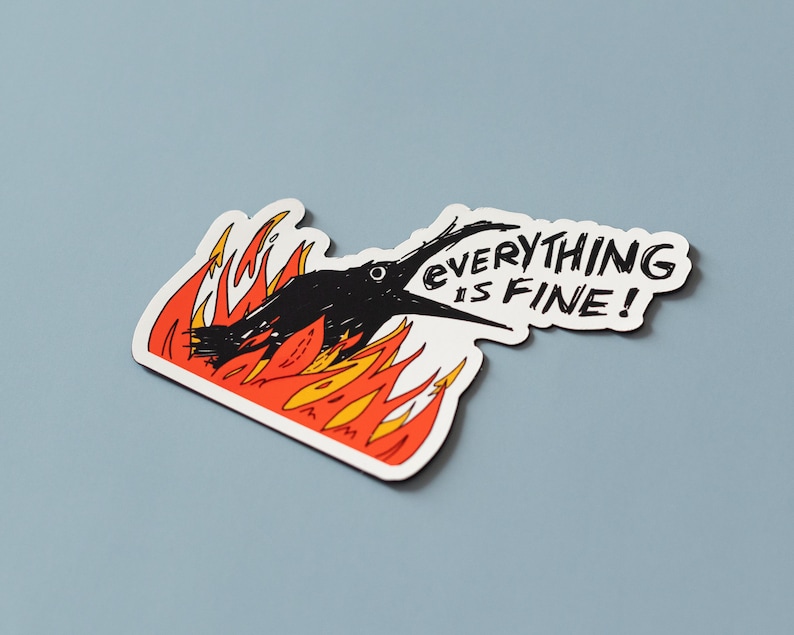 May include: A black bird with a speech bubble that says "Everything is fine!" The bird is on fire with orange and yellow flames.