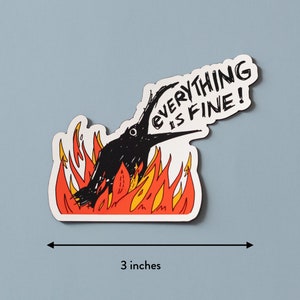 May include: A black bird with its beak open is on fire. The bird is surrounded by orange and yellow flames. The text "EVERYTHING IS FINE!" is written in black on a white background above the bird.