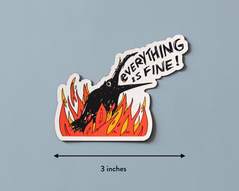 May include: A black bird with its beak open is on fire. The bird is surrounded by orange and yellow flames. The text "EVERYTHING IS FINE!" is written in black on a white background above the bird.