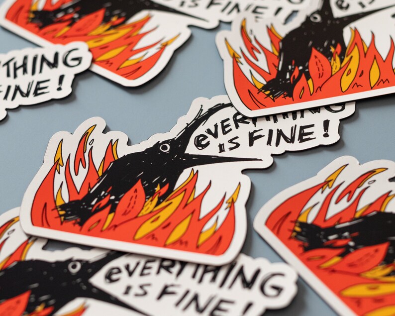 May include: A set of black and white stickers with a cartoon crow on fire. The stickers say "Everything is fine!" in a black and white hand-drawn font.