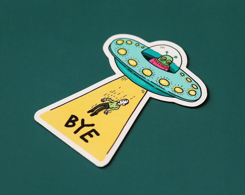May include: A yellow sticker with the word "BYE" in black lettering. A cartoon alien in a flying saucer is leaving a person behind.