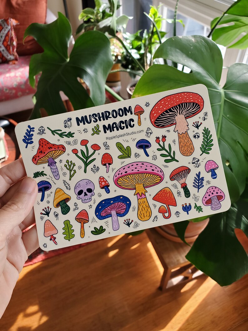 May include: A white card with a colorful illustration of mushrooms and the text "Mushroom Magic" and "RippleSplashStudio.com".