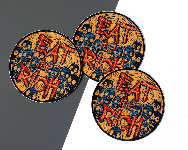 May include: Three round stickers with an orange background and black outlines. Each sticker features a stylized illustration of a crowd of faces with the text "Eat the Rich" in red and blue.