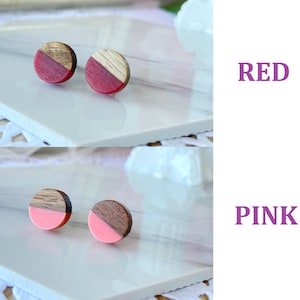 May include: Two pairs of round wooden stud earrings. One pair features a red and wood grain design, the other pair has a pink and wood grain design. The word "RED" and "PINK" are displayed in purple text.