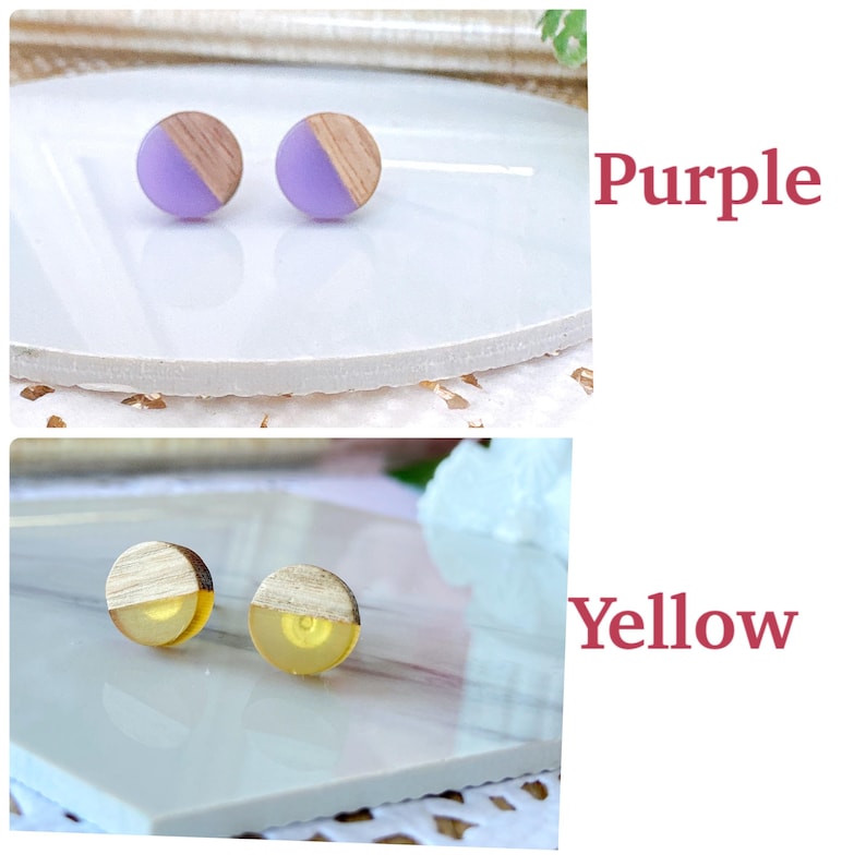 May include: A pair of stud earrings with a wooden half-circle design and a purple resin half-circle. The earrings are displayed on a white surface. The word "Purple" is written in a pink font.