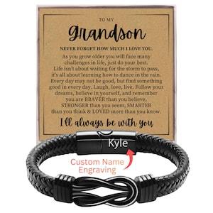May include: A black braided leather bracelet with a stainless steel clasp. The bracelet features a knot design and is personalized with the name "Kyle". A card with the text "To My Grandson" and a message is in the background.