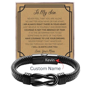 May include: Black braided leather bracelet with a stainless steel clasp. The bracelet features a knot design and the text "Custom Name". A card behind the bracelet reads "To My Son" with a heartfelt message.