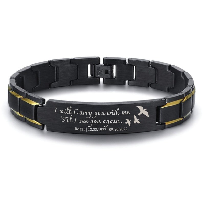 May include: Black and gold stainless steel bracelet with an engraved message: "I will Carry you with me 'Til I see you again... Roger | 12.22.1977 - 09.20.2022". Two small birds are engraved on the bracelet.