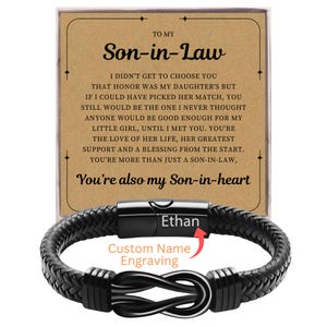 May include: Black braided leather bracelet with a stainless steel clasp, engraved with the name "Ethan." The bracelet is paired with a card that reads "To My Son-in-Law" and a heartfelt message. The card and bracelet are a gift set.