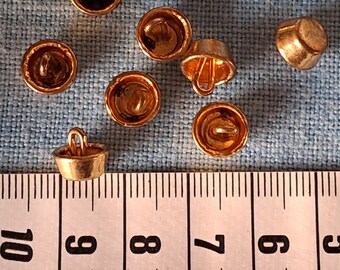 10 Vintage Diminutive Brass Buttons. One Piece Metal Buttons. Looking Like "Cakes". Extra Long Loop Shanks. Probably from the 1960's.