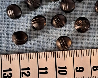 19 Vintage Diminutive Black Glass Buttons. Same Double Striped Pattern on all. Self shanks. Probably from the 1920's. Diameter 9 mm.