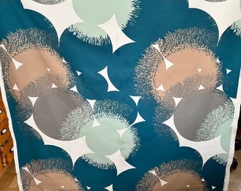 May include: Teal fabric with a repeating pattern of white, gray, and light blue circles. The circles have a textured, brushstroke-like design.