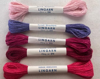May include: Five spools of embroidery floss in various colors, including pink, purple, red, and burgundy. Each spool is labeled "Svensk Hemslöjds Lingarn" with a corresponding color number.