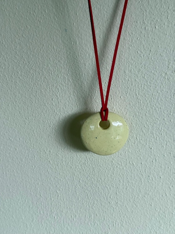 Ceramic pendant necklace with faux suede cord