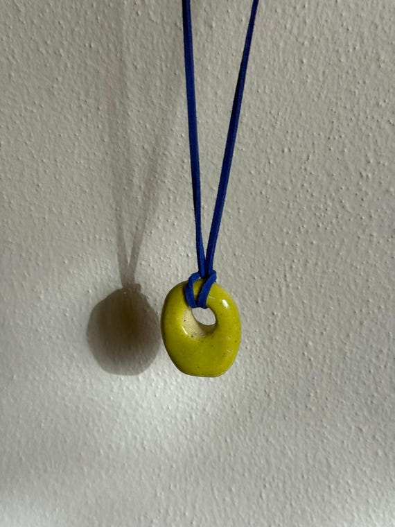 Ceramic pendant necklace with faux suede cord