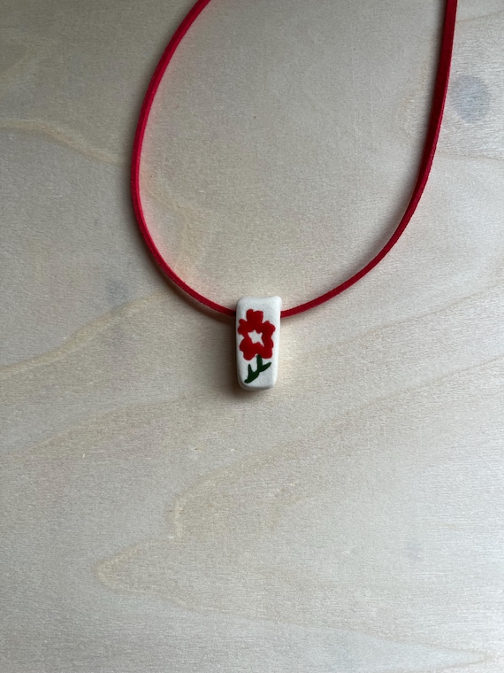 Ceramic red flower bead necklace with faux suede cord
