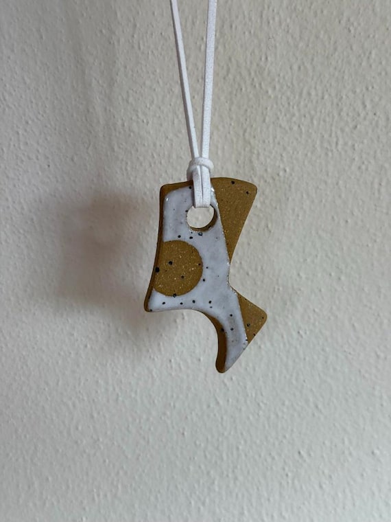 Ceramic pendant necklace with faux suede cord