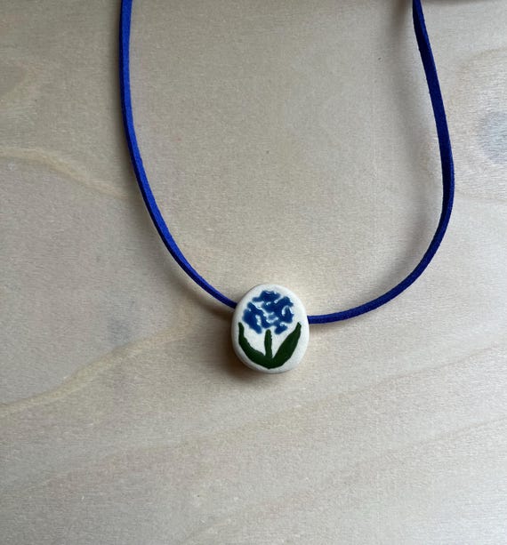 Ceramic blue flower bead necklace with faux suede cord
