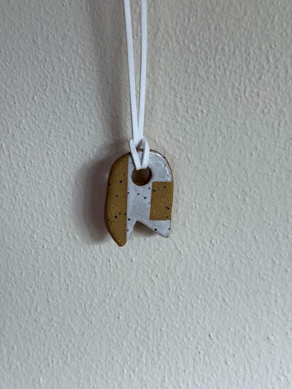 Ceramic pendant necklace with faux suede cord