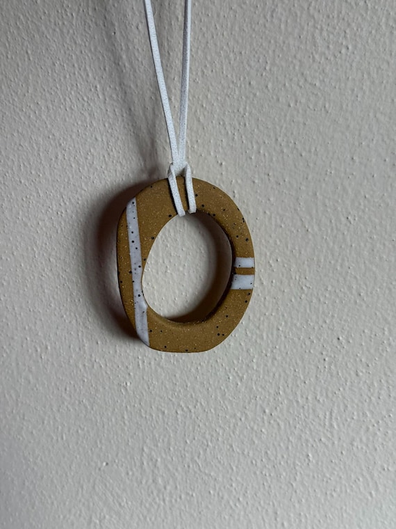Ceramic pendant necklace with faux suede cord