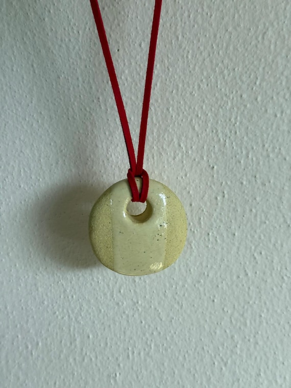 Ceramic pendant necklace with faux suede cord